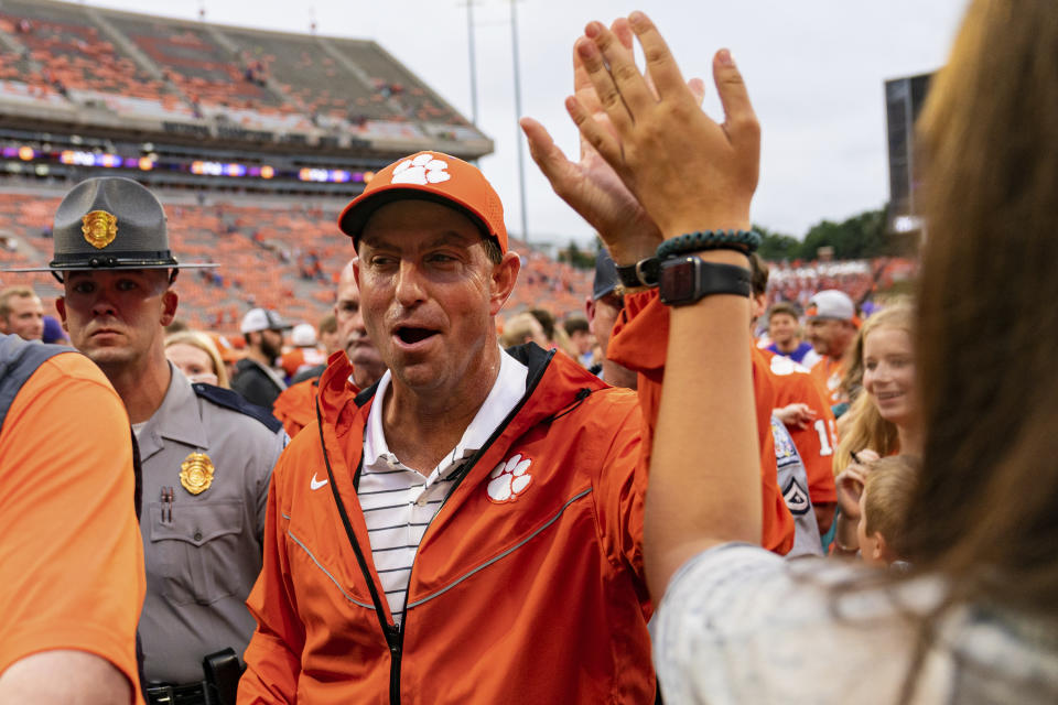 Clemson Tigers head coach Dabo Swinney celebrates after defeating the Furman Paladins during an NCAA college football game in Clemson, S.C., Saturday, Sept. 10, 2022. (AP Photo/Jacob Kupferman)