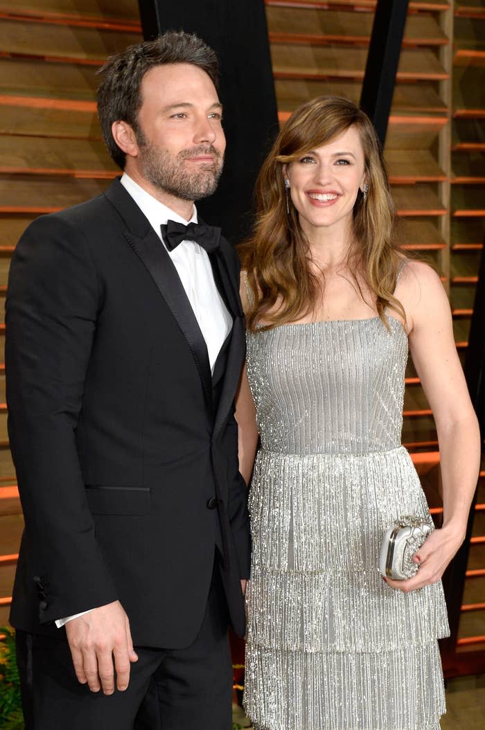 Affleck and Garner stands next to each other at an event