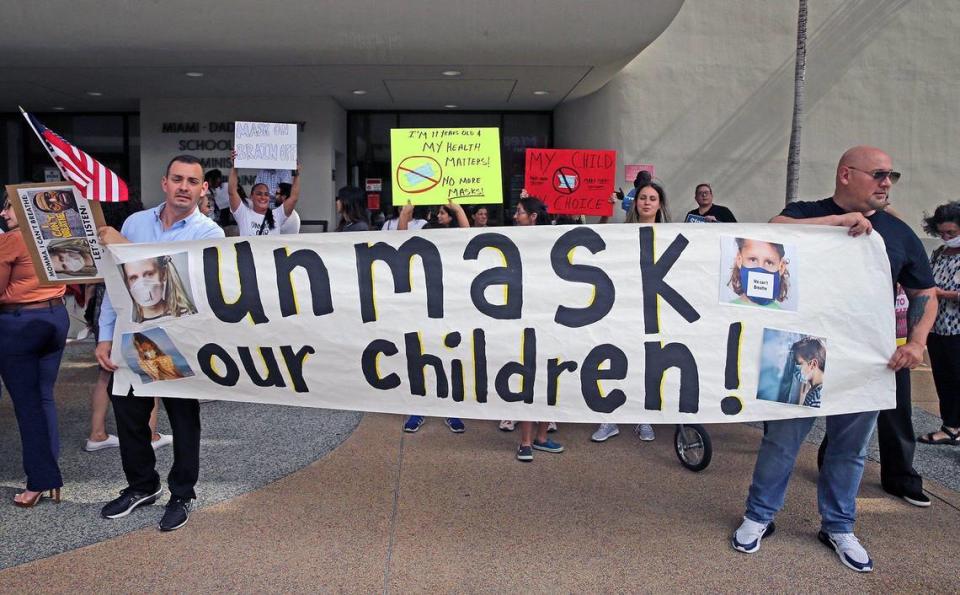 Protesters at an “Un-mask Our Kids” rally at the Miami-Dade School Board administration building on May 19, 2021. Twenty-one speakers signed up to speak about masks during public comment. Many were against masks in schools.