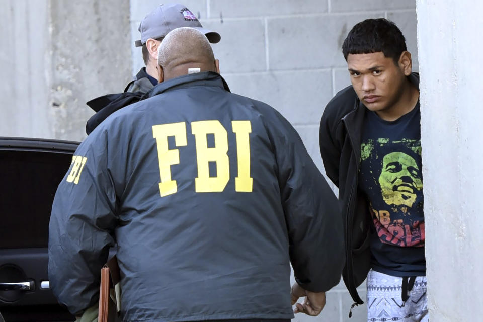 FILE - In this Thursday, March 2, 2017 photo, accused MS-13 gang member Alexi Saenz, is escorted by FBI agents in Central Islip, N.Y., after being taken into custody. Saenz pleaded guilty Wednesday, July 10, 2024 in federal court in Central Islip to racketeering and firearms charges in a case involving eight murders. Among the deaths he's charged with on Long Island are the 2016 killings of Brentwood teenagers Kayla Cuevas and Nisa Mickens. (James Carbone/Newsday via AP, File)