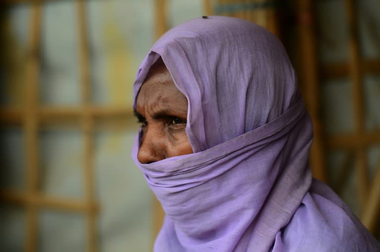 A Rohingya refugee has her picture taken by a volunteer collecting information of alleged abuses by Myanmar soldiers, at a data collection site in the Kutupalong refugee camp in Ukhia