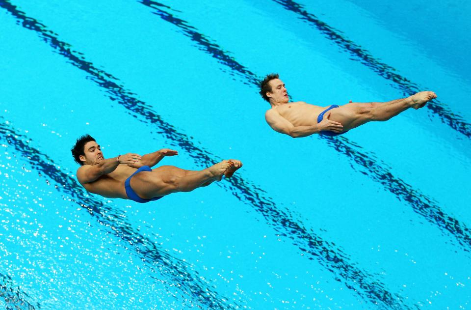 DELHI, INDIA - OCTOBER 12: Alexandre Despatie and Reuben Ross of Canada compete in the Men's 3m Synchro Springboard Final at Dr. S.P. Mukherjee Aquatics Complex on day nine of the Delhi 2010 Commonwealth Games on October 12, 2010 in Delhi, India. (Photo by Cameron Spencer/Getty Images)