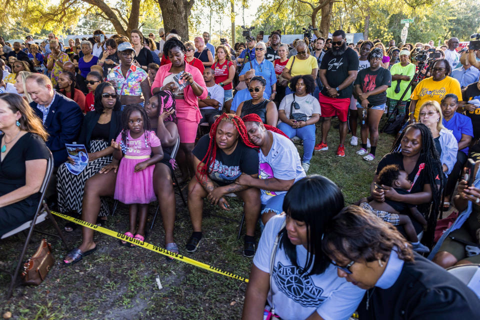 Trisha James, center, in black shirt, with Sabrina Rozier and Ieasia Gallion, 4, all relatives of Jacksonville shooting victim Jerrald De’Shaun Gallion of a deadly shooting that took place in Jacksonville, Fla. on Aug. 27, 2023.  (Saul Martinez / The Washington Post via Getty Im)