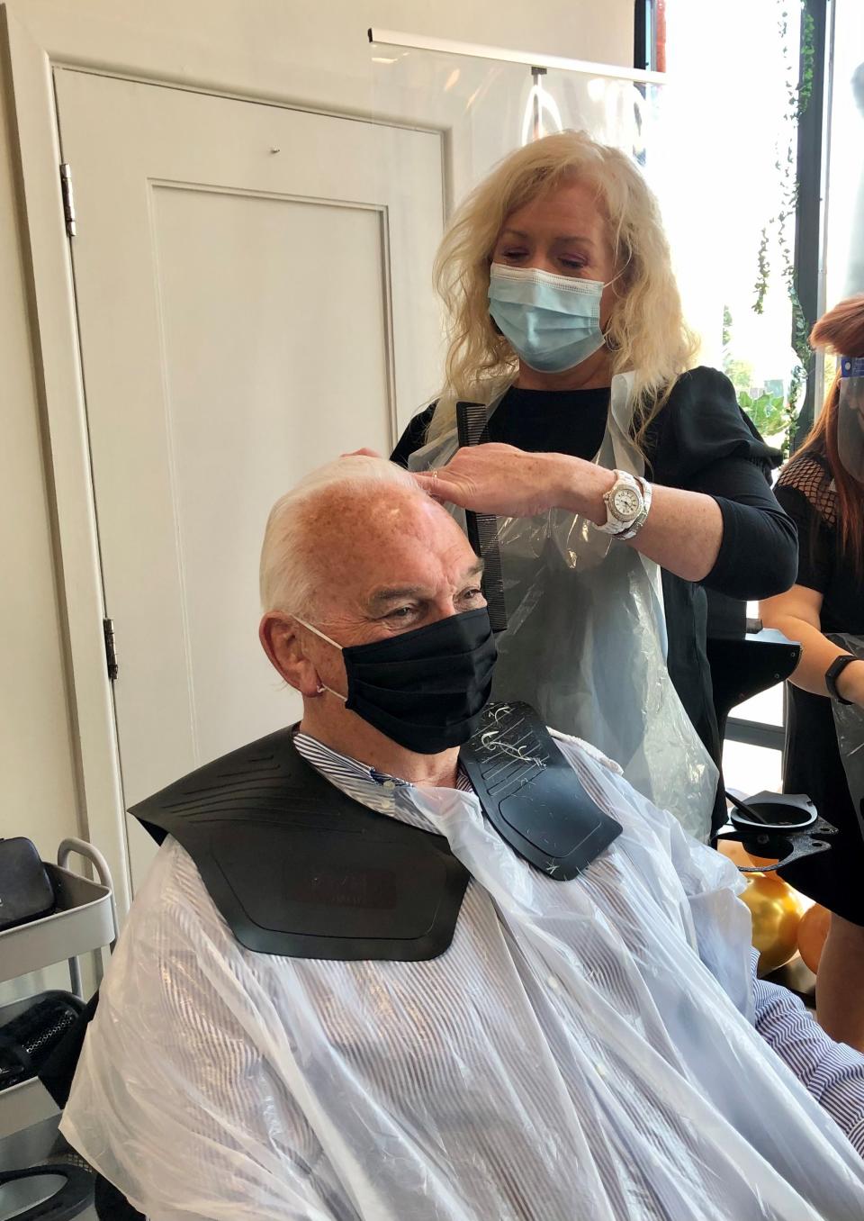 Martine Broggy cuts David Tinsley’s hair at the Natural Hair Company in Lisburn (David Young/PA)