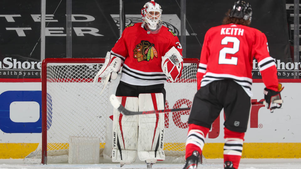 CHICAGO, IL - JANUARY 31: Kevin Lankinen #32 celebrates with Duncan Keith #2 of the Chicago Blackhawks after the Chicago Blackhawks defeated the Columbus Blue Jackets 3-1 at United Center on January 31, 2021 in Chicago, Illinois. (Photo by Chase Agnello-Dean/NHLI via Getty Images)