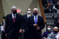 U.S. Vice President Mike Pence walks with Rev. Billy Graham's son Rev. Franklin Graham as they attend Sunday Worship Service at Alliance Bible Fellowship in Boone, North Carolina