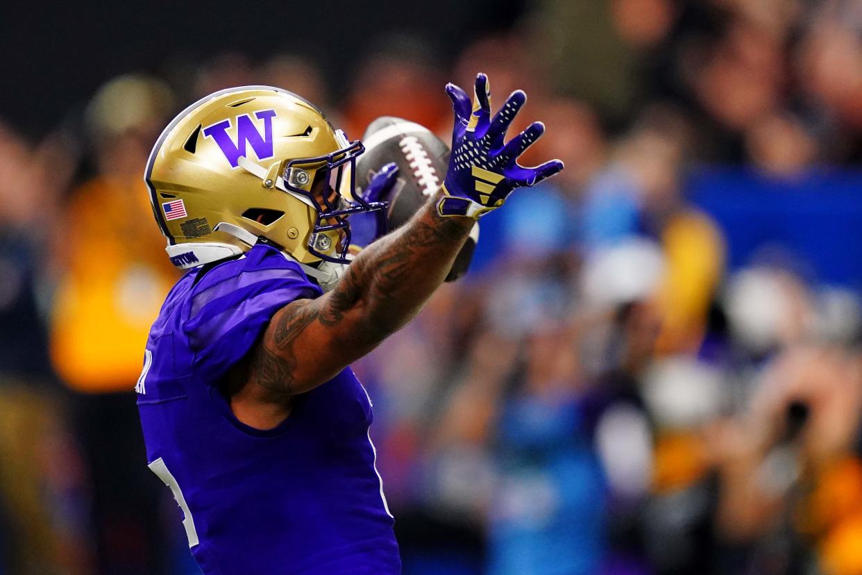 Jan 1, 2024; New Orleans, LA, USA; Washington Huskies wide receiver Ja'Lynn Polk (2) celebrates after catching a touchdown pass during the second quarter against the Texas Longhorns in the 2024 Sugar Bowl college football playoff semifinal game at Caesars Superdome.