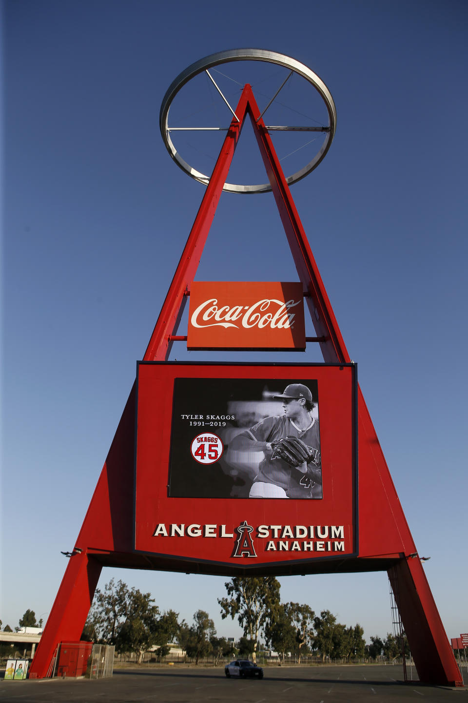 The Los Angeles Angels give their condolences on the marquee at "Big A" for pitcher Tyler Skaggs at Angel Stadium in Anaheim, Calif., Monday, July 1, 2019. Skaggs died at the age of 27, stunning Major League Baseball and leading to the postponement of the team's game against the Texas Rangers on Monday. (AP Photo/Alex Gallardo)