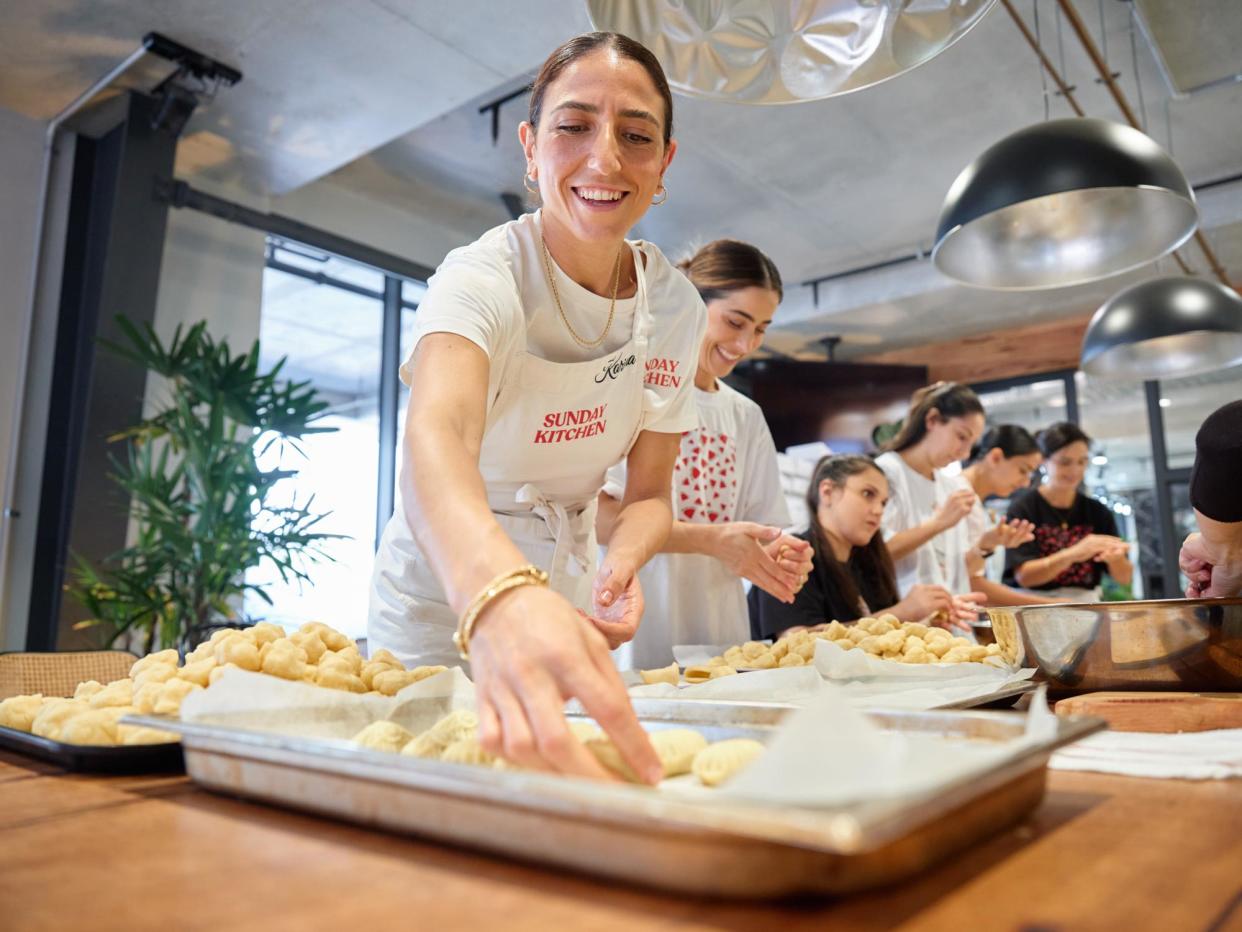 <span>Karima Hazim and Bake for Gaza volunteers prepare ma’moul biscuits for baking at a Sydney cafe.</span><span>Photograph: Bahram Mia/The Guardian</span>