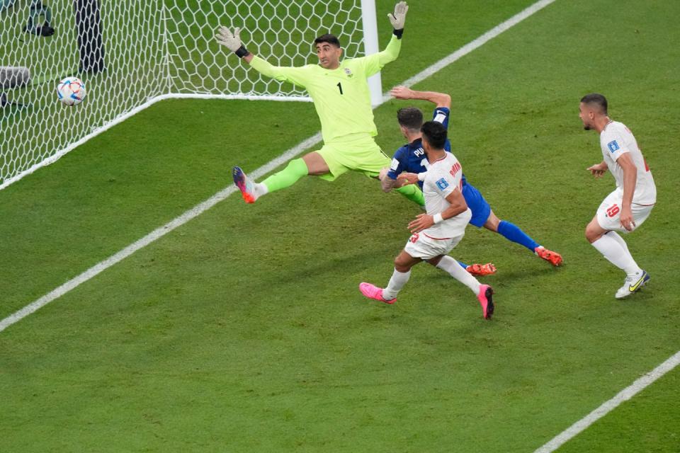 Christian Pulisic of the United States scores his side's opening goal during the World Cup group B football match between Iran and the United States at the Al Thumama Stadium in Doha, Qatar, Tuesday, Nov. 29, 2022. (AP Photo/Luca Bruno)