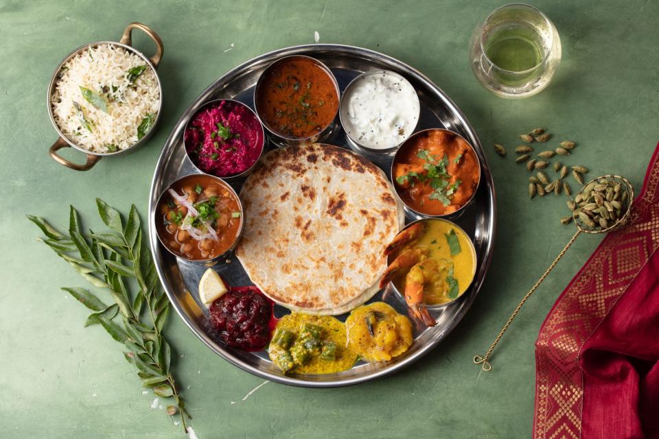 A traditional Indian thali-style presentation at Ela Curry Kitchen in Palm Beach Gardens.