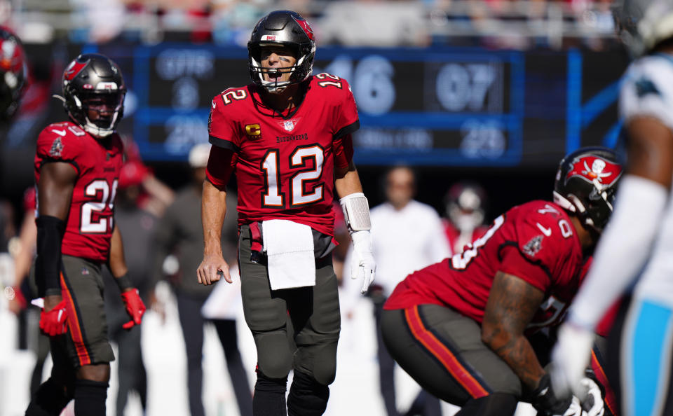 Tampa Bay Buccaneers quarterback Tom Brady (12) directs his team during the second half of an NFL football game against the Carolina Panthers Sunday, Oct. 23, 2022, in Charlotte, N.C. (AP Photo/Jacob Kupferman)