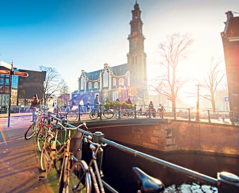 Amsterdam is one of the world's greatest cycling cities - Credit: DANIEL HERNANZ RAMOS