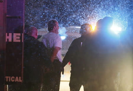 A suspect is taken into custody outside a Planned Parenthood center in Colorado Springs, Colorado November 27, 2015. REUTERS/Isaiah J. Downing