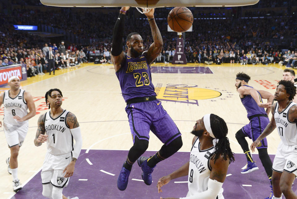 LOS ANGELES, CA - MARCH 22: LeBron James #23 of the Los Angeles Lakers scores basket against DeMarre Carroll #9 of the Brooklyn Nets during the second half at Staples Center on March 22, 2019 in Los Angeles, California. NOTE TO USER: User expressly acknowledges and agrees that, by downloading and or using this photograph, User is consenting to the terms and conditions of the Getty Images License Agreement. (Photo by Kevork Djansezian/Getty Images)