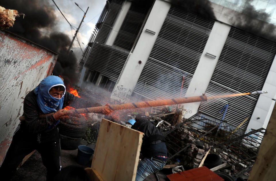 A demonstrator fires a homemade weapon during a protest against Ecuador's President Lenin Moreno's austerity measures in Quito, Ecuador October 12, 2019.  (Photo: Ivan Alvarado/Reuters)