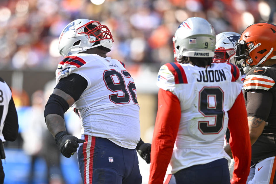 New England Patriots defensive tackle Davon Godchaux (92) celebrates beside linebacker Matthew Judon (9) after sacking Cleveland Browns quarterback Jacoby Brissett during the second half of an NFL football game, Sunday, Oct. 16, 2022, in Cleveland. (AP Photo/David Richard)