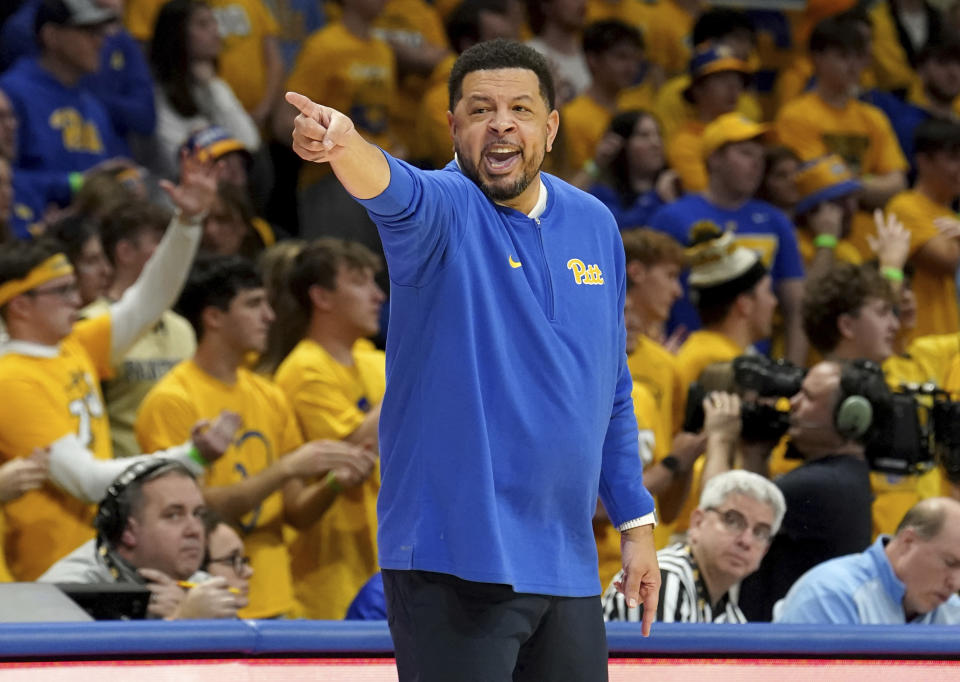Pittsburgh head coach Jeff Capel calls out to his team during the first half of an NCAA college basketball game against North Carolina Tuesday, Jan. 2, 2024, in Pittsburgh. (AP Photo/Matt Freed)