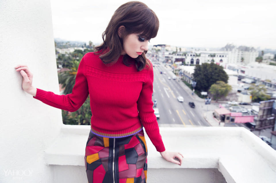 Alison Brie in a red Coach sweater.  