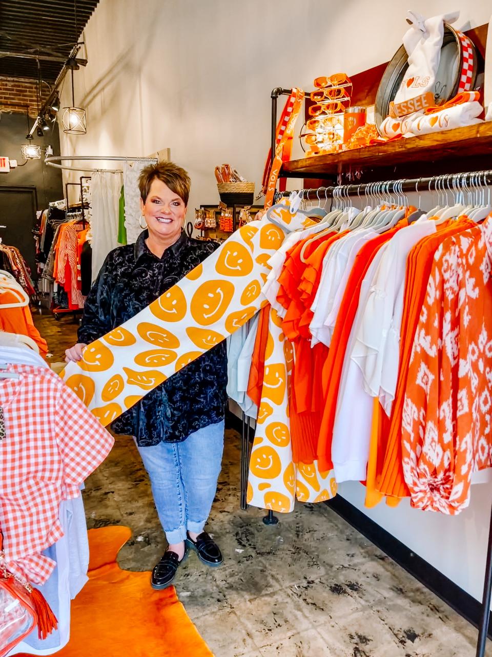 DeAnne McLemore Thomas, owner of SoKno Throwback and Threads, shows one of her new favorite pants.