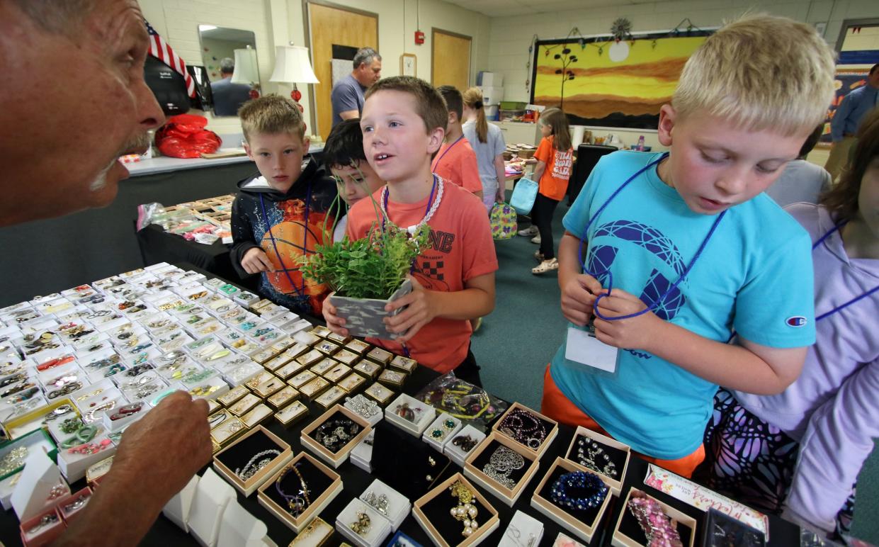 Students pick out a free gift to give for Mother’s Day Tuesday morning, May 7, 2024, at Cherryville Elementary School.
