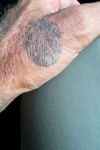 <p>courtesy John Schneider</p> John Schneider's tattoo of Alicia Allain Schneider's thumbprint