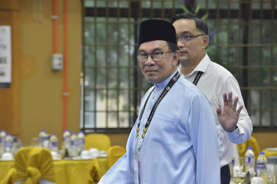 Malaysian opposition leader Anwar Ibrahim walks into a nomination center for the upcoming general election in Tambun, Malaysia, Saturday, Nov. 5, 2022. Campaigning for Malaysia’s general elections formally started Saturday, in a highly competitive race that will see the world’s longest-serving coalition seeking to regain its dominance four years after a shocking electoral loss. (AP Photo/JohnShen Lee)