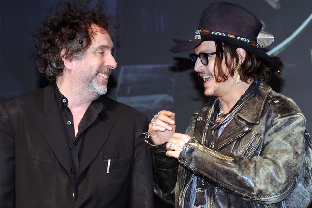 <p>TOSHIFUMI KITAMURA/AFP/GettyImages</p> Tim Burton and Johnny Depp in 2012