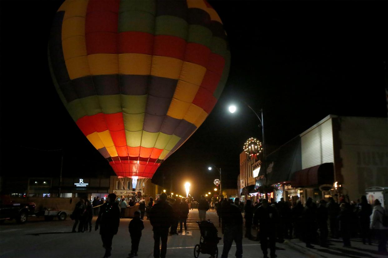 Balloon pilots helped light up the Indianola Square on Dec. 6 to kick off the holiday celebrations. Warren County communities began celebrating Christmas with events on Dec. 6 and 7.