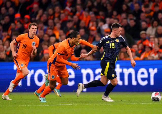 Scotland’s Lawrence Shankland and the Netherlands’ Virgil van Dijk battle for the ball 