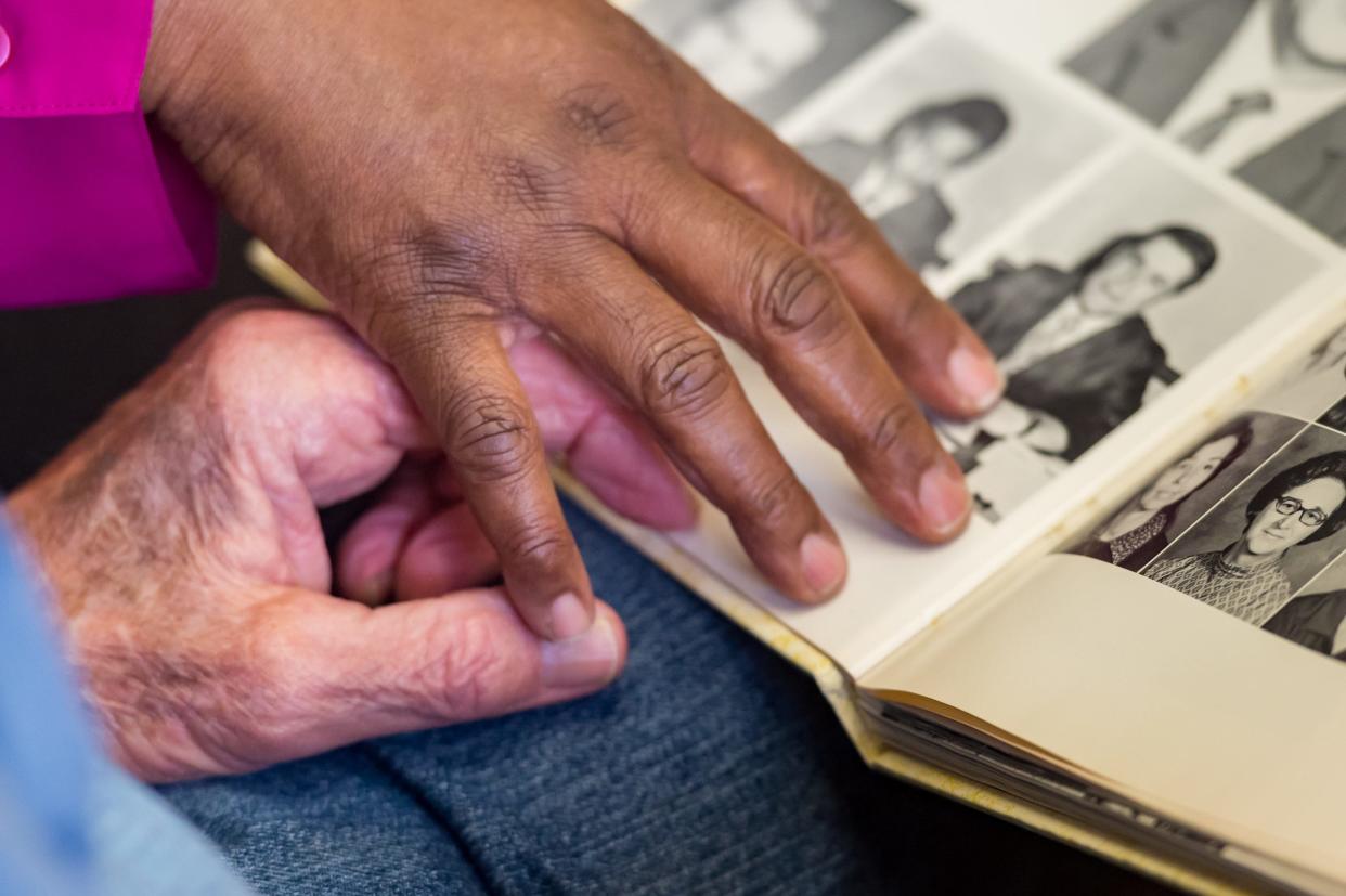 Antoinette Pete and Jimmy Meche look at yearbooks from the early 1970s at Crowley High. Pete was a ninth-grader and Meche her assistant principal when the school was integrated in 1971. Monday, April 26, 2021.