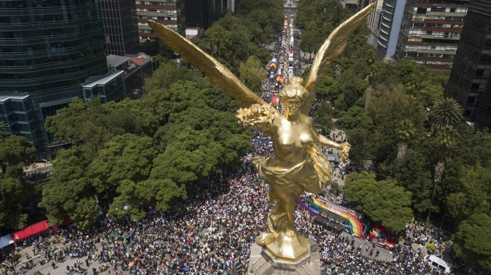 Mexico City's Angel of Independence dominates the starting point of the gay pride parade in Mexico City, Saturday, Jun. 29, 2019. (AP Photo/Christian Palma)