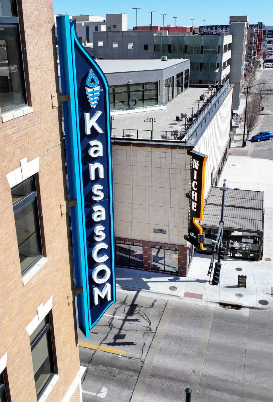 This photo captures work that Miracle Signs did at the Kansas College of Osteopathic Medicine, left, and George Lay Signs did at the nearby NICHE culinary school. Miracle is buying George Lay Signs this week.