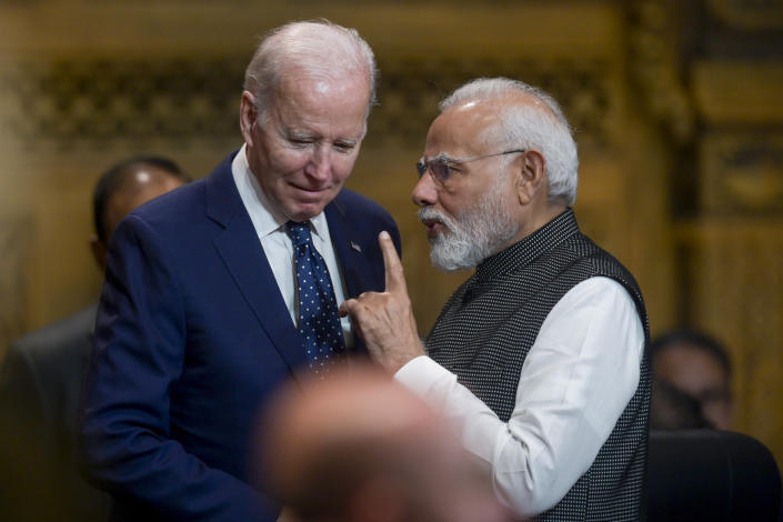 U.S. President Joe Biden, left, talks with India's Prime Minister Narendra Modi during the G20 Summit in Nusa Dua, Bali, Indonesia, Tuesday Nov. 15, 2022. (Bay Ismoyo/Pool Photo via AP)