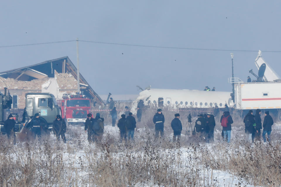 ALMATY, KAZAKHSTAN - DECEMBER 27, 2019: The site of a crash of a Bek Air plane carrying 95 passengers and 5 crew members near Almaty Airport. A Bek Air Fokker 100 passenger plane flying from Almaty to Nur-Sultan has crashed minutes after takeoff, broken through a concrete guardrail and clashed into a two-storey building. The accident has killed at least 14 people, dozens have been injured. Pavel Aleksandrov/TASS (Photo by Pavel Aleksandrov\TASS via Getty Images)