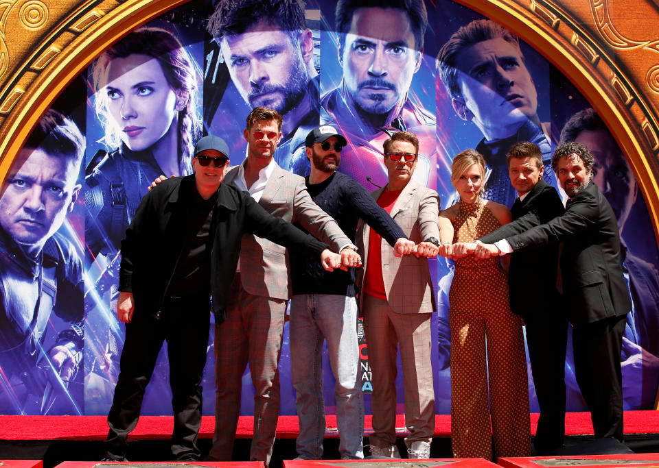 Actors Robert Downey Jr., Chris Evans, Mark Ruffalo, Chris Hemsworth, Scarlett Johansson, Jeremy Renner and Marvel Studios President Kevin Feige pose for a photo during the handprint ceremony at the TCL Chinese Theatre in Hollywood, Los Angeles, California, U.S. April 23, 2019. REUTERS/Mario Anzuoni