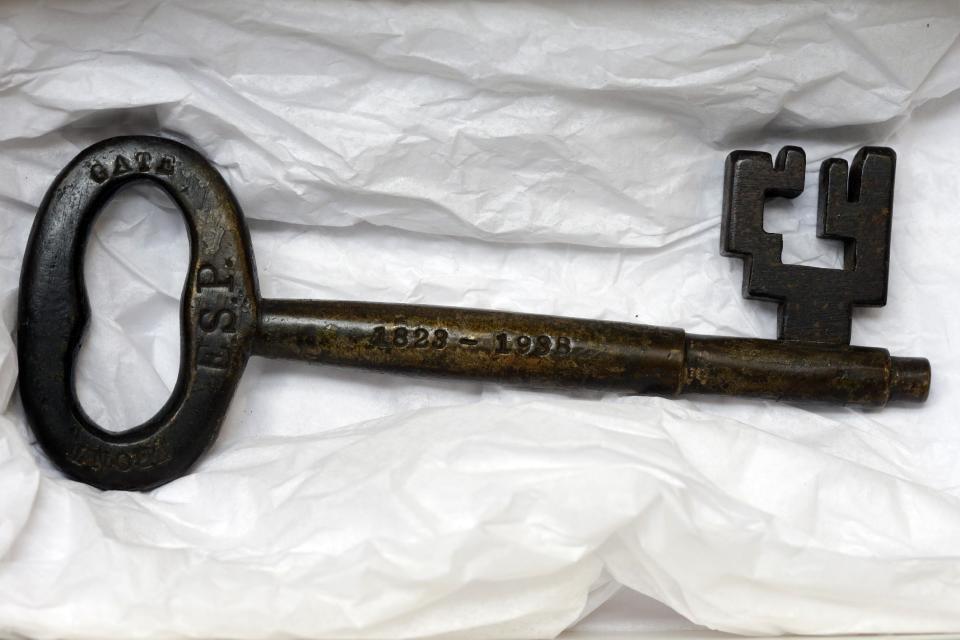 In this Tuesday, March 12, 2013 photo, shown is a key to the original front gate at the Eastern State Penitentiary in Philadelphia. The defunct and decayed prison that serves as one of Philadelphia's quirkiest tourist attractions, plans to displaying dozens of never-before-seen artifacts for 10 days only in a "pop-up museum." (AP Photo/Matt Rourke)