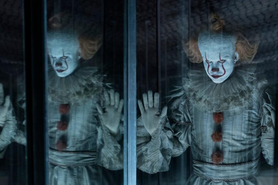 Pennywise (Bill Skarsgard) creeps out the adult Losers' Club in the horror sequel 