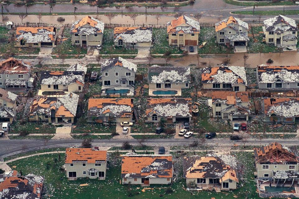 In this Aug. 25, 1992, file photo, rows of damaged houses sit between Homestead and Florida City, Fla. Almost 25 years after Hurricane Andrew struck south of Miami, a new insurance underwriters' analysis says the city's vulnerability to another Category 5 hurricane has grown exponentially.