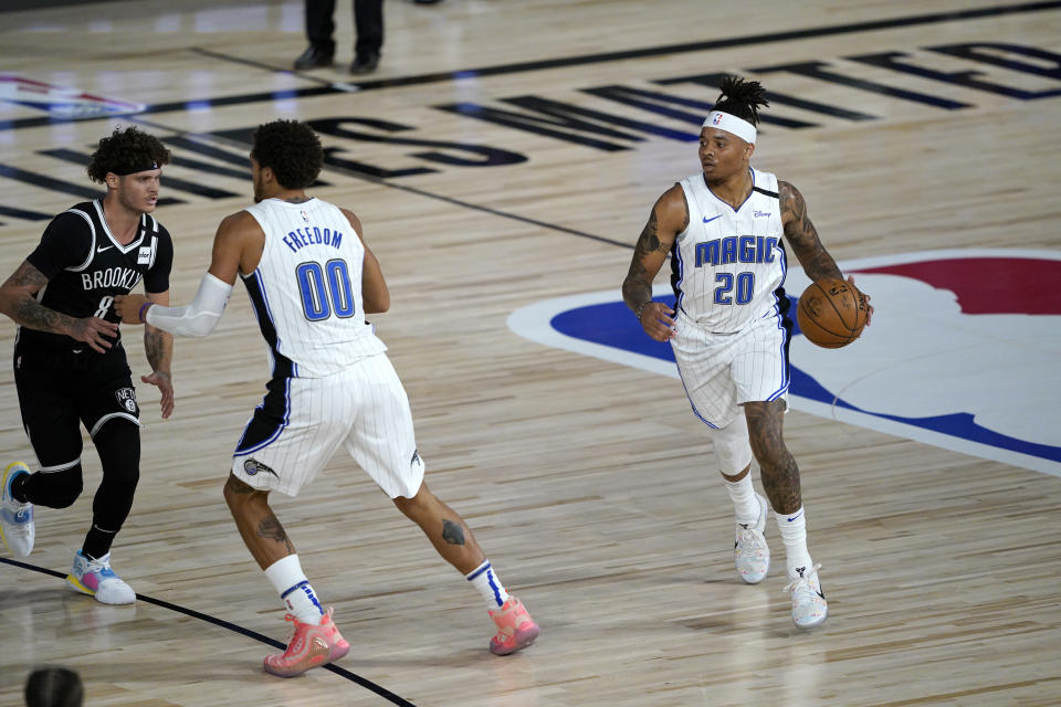 Orlando Magic's Markelle Fultz (20) brings the ball down the court during the first half of an NBA basketball game against the Brooklyn Nets Friday, July 31, 2020, in Lake Buena Vista, Fla. (AP Photo/Ashley Landis, Pool)