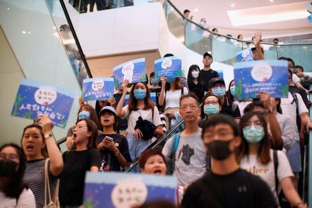 Anti-government protesters hold a rally in a shopping mall in Sha Tin, Hong Kong, China