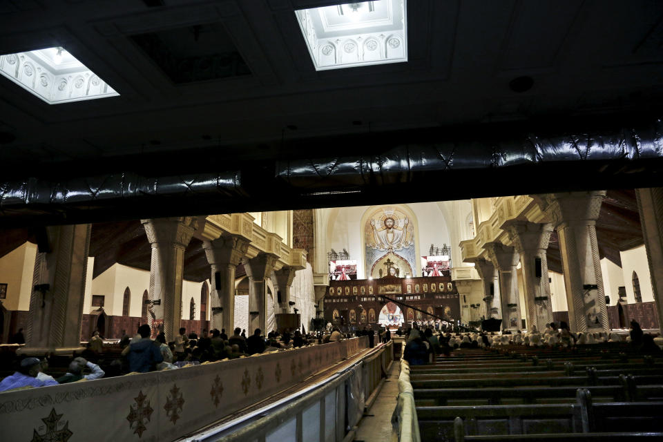 Egyptian Coptic Christians prepare to pray during the Easter Eve service at St. Mark's Cathedral in Cairo, Egypt, Saturday, April 15, 2017. In February, a series of murders and killings claimed by IS in northern Sinai led hundreds of families to evacuate the area, fleeing west. The most recent major attack came on Palm Sunday. (AP Photo/Nariman El-Mofty)