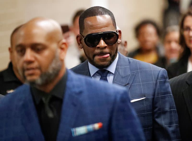 FILE PHOTO: Grammy-winning R&B singer R. Kelly arrives for a child support hearing in Chicago