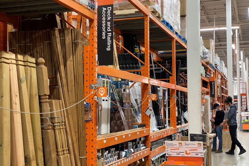 FILE PHOTO: Customers browse among the decking supplies aisle in a Home Depot store in Toronto