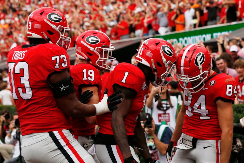 Georgia wide receiver Ladd McConkey (84) celebrates with his teammates after scoring a touchdown during the first half of a NCAA college football game between Tennessee and Georgia in Athens, Ga., on Saturday, Nov. 5, 2022.

News Joshua L Jones