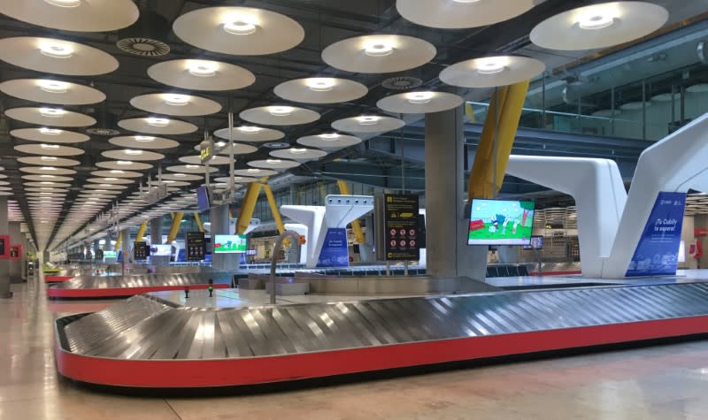 Empty baggage carousels are seen at Madrid's Adolfo Suarez Barajas Airport