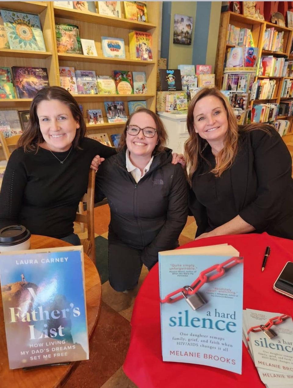 From left, Laura Carney, Chelsea Boes and Melanie Brooks at a book signing Jan. 20, 2024, at Malaprop's.