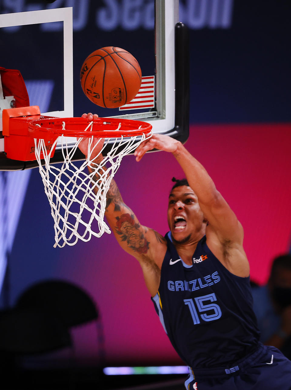 Brandon Clarke of the Memphis Grizzlies slam dunks the ball during the second half of an NBA basketball game Tuesday, Aug. 11, 2020, in Lake Buena Vista, Fla. (Mike Ehrmann/Pool Photo via AP)