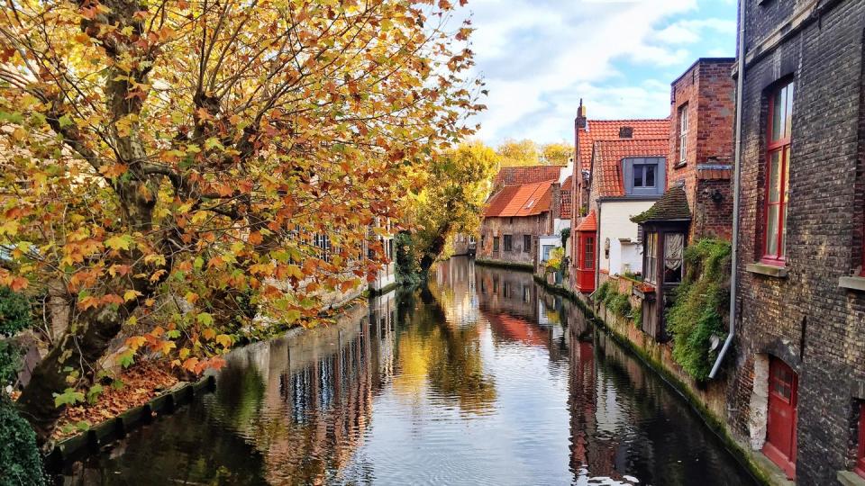 Canal Amidst Trees Against Sky