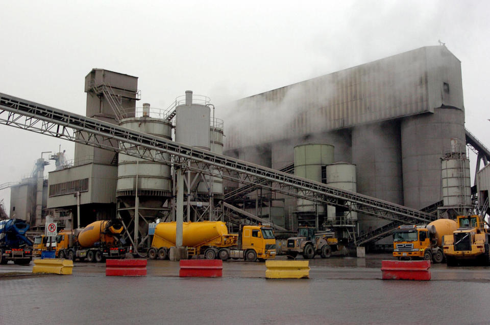 IRELAND - NOVEMBER 11:  Lorries queue at the cement dispensing outlet at the CRH Plc. quarry in west Dublin, Ireland, Thursday, November 11, 2004. CRH Plc, the world's third-largest maker of building materials, plans to raise prices and step up acquisitions to extend a 12-year run of profit gains and counter higher raw-material costs, said Chief Executive Liam O'Mahony.  (Photo by John Cogill/Bloomberg via Getty Images)